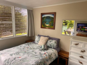 Lower level unit in the backyard, past the gate on the right of house, Auckland
